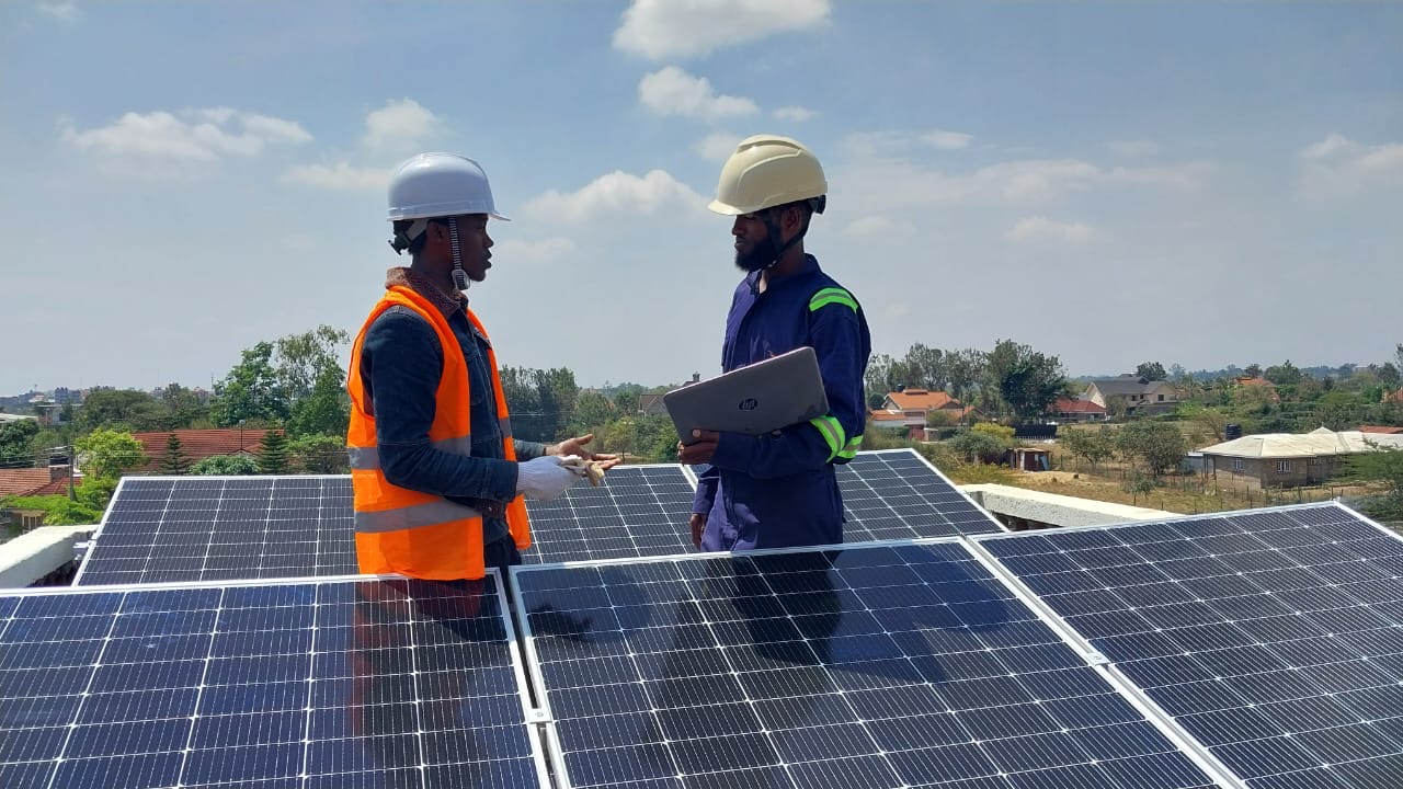 VVS engineers reviewing solar system design on site